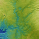 A topographic color-coded view of the region. Lower altitude areas are shown in blues and purples, while higher regions show up in whites, yellows, and reds,